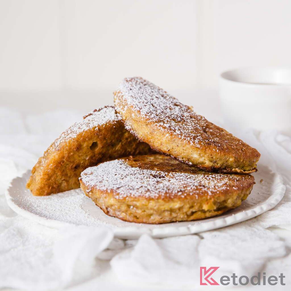 Quick Low-Carb French Toast with sweetener dusting, cinnamon and syrup.