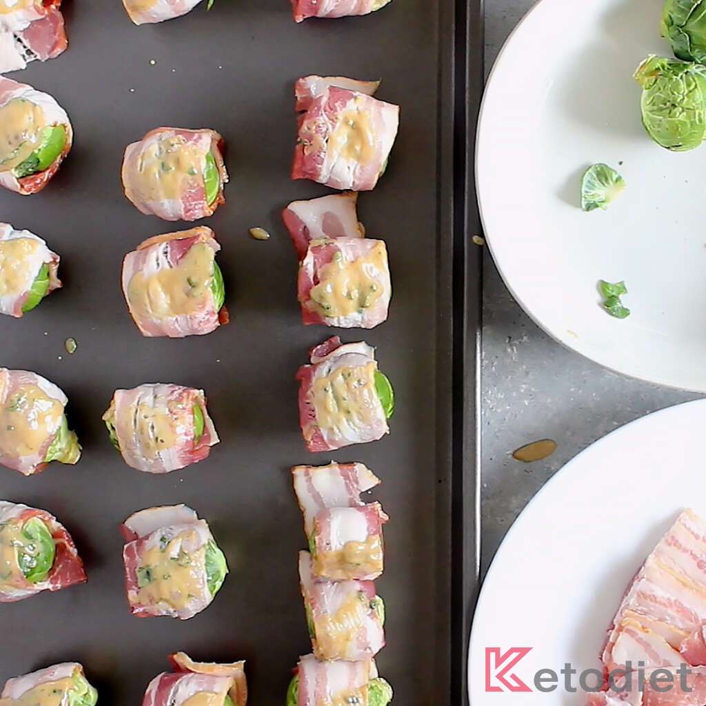 Bacon wrapped Brussels sprouts brushed with mustard glaze.