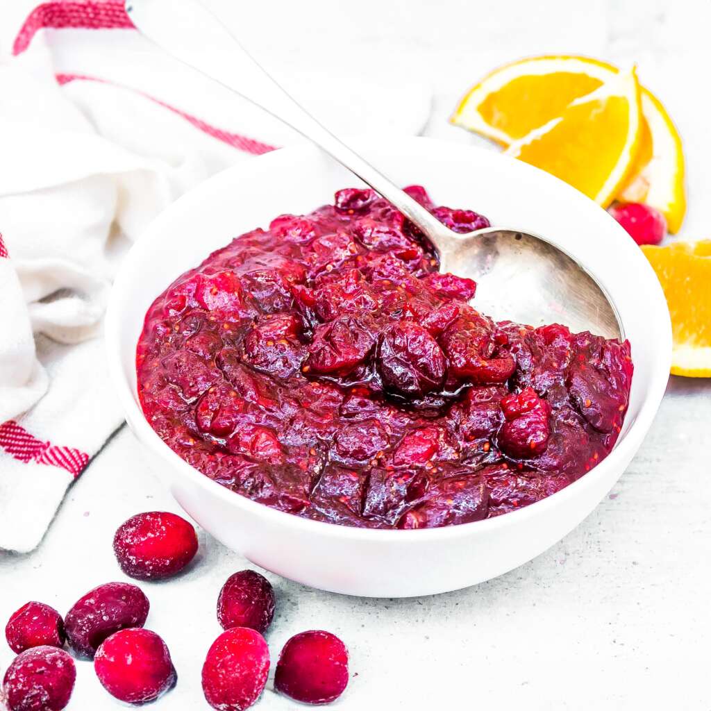 The Best Sugar-Free Cranberry Sauce recipe with orange and warming spices.