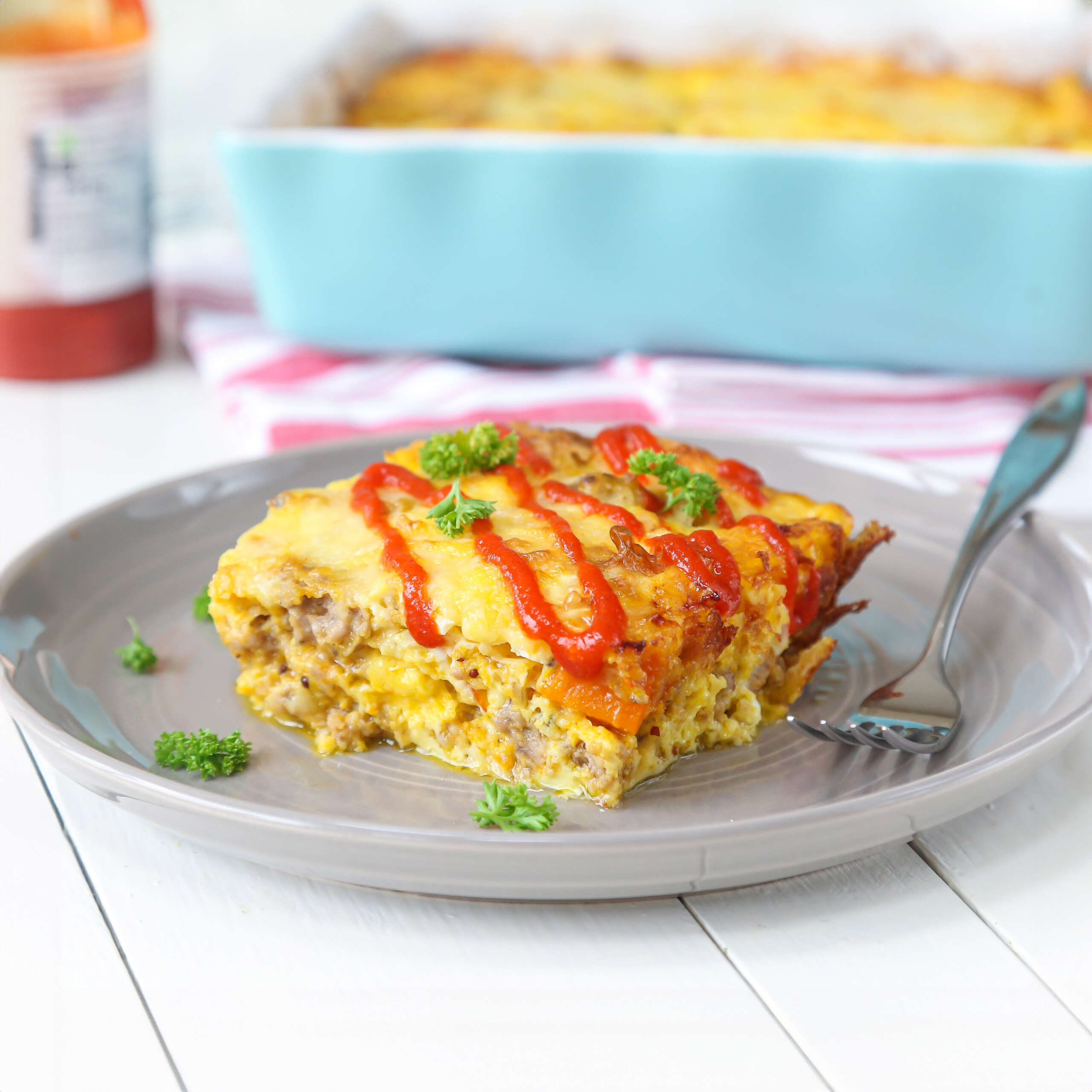 Low-Carb Casserole with Pumpkin and Sausage recipe with sriracha topping.