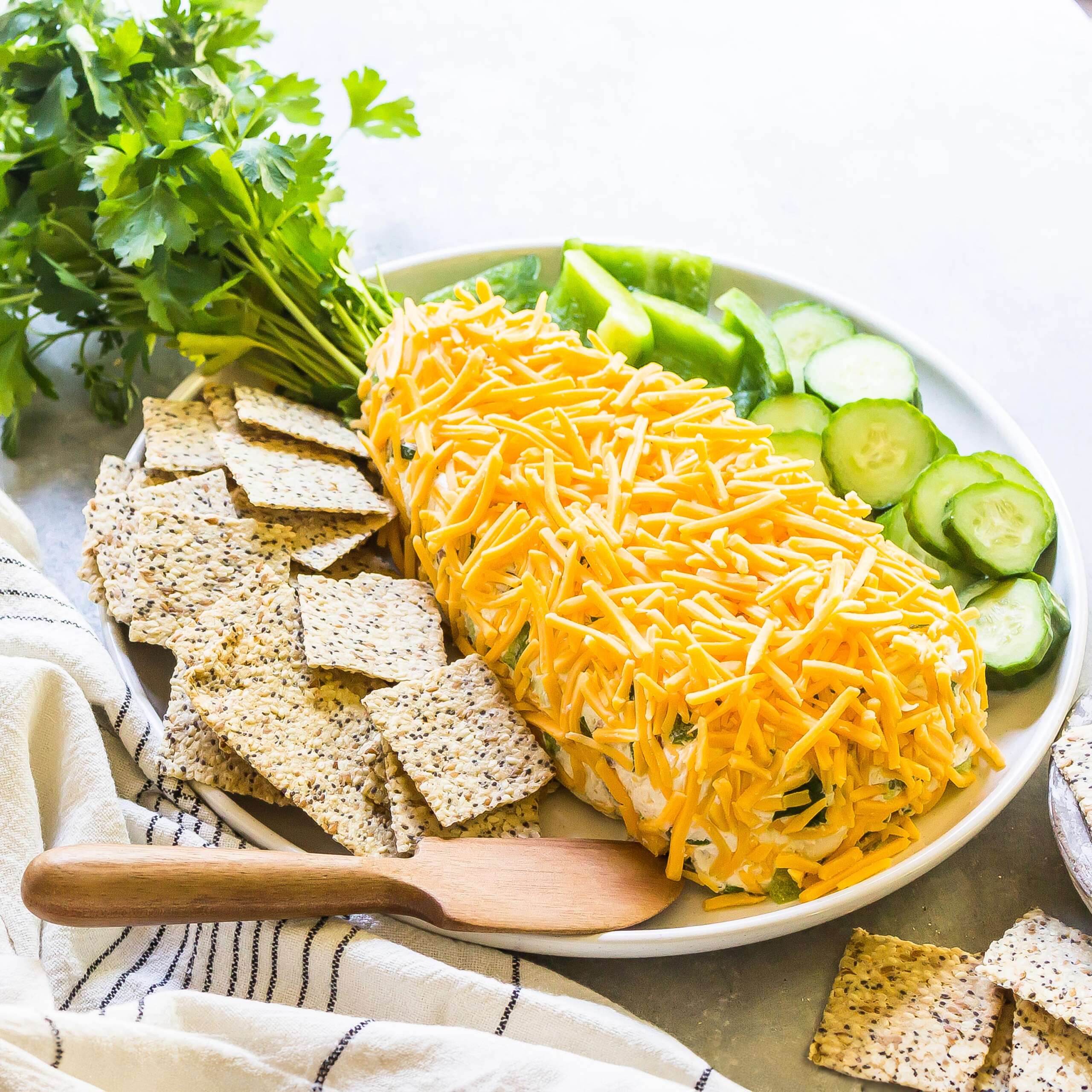 Easter Cheese Ball Recipe served with low-carb crackers.